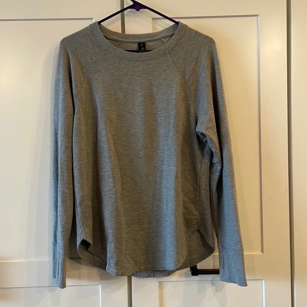 Coreio sweatshirt. Medium weight. Thumb holes. Rounded bottom covers leggings!